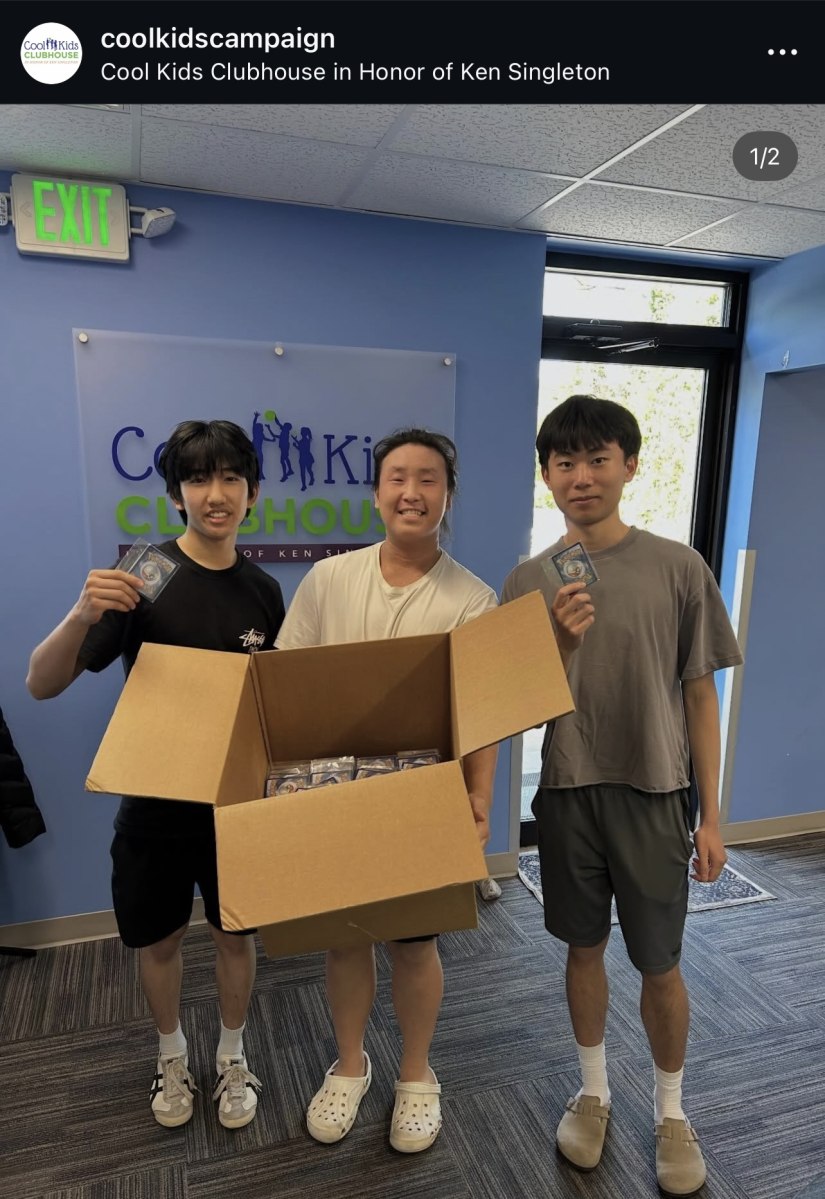 Three people holding Pokémon cards and a donation box at Cool Kids Clubhouse, shown in an Instagram screenshot.